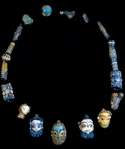 Necklace in glass paste with pendants depicting bearded heads, originally from Olbia, National Archeological Museum of Cagliari by Phoenician Phoenician