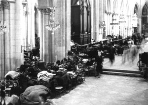 People taking refuge in Caen Cathedral, July 1944 by Photographer French