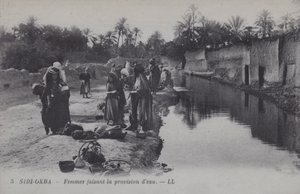 Women collecting water in Sidi-Okba, Algeria by Photographer French