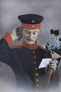 German Soldier Holding a Note and a Bunch of Flowers by Photographer German