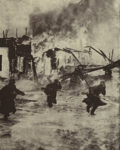 German soldiers advancing through the burning ruins of Rotterdam after its bombing by the Luftwaffe, World War II, May 1940 by Photographer German