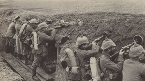 German soldiers in the trenches in Flanders firing through loopholes made from small wooden boxes and sewer pipes