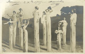 Women on stilts dressed as asparagus by Photographer German