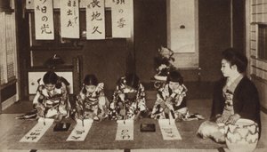 Japanese schoolgirls writing with brushes in a kindergarten class by Photographer Japanese
