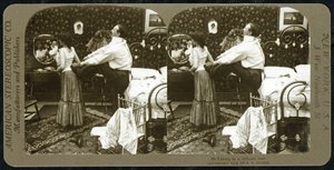 Stereoscopic card depicting a woman being laced into a corset