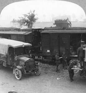 Troops and supplies are rushed from a railhead to the firing line, World War I