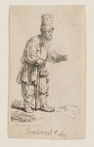 A Peasant in a High Cap, Standing and Leaning on a Stick by Rembrandt van Rijn