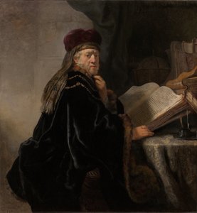 A Scholar Seated at a Desk by Rembrandt van Rijn