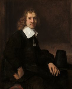 A Young Man Seated at a Table by Rembrandt van Rijn