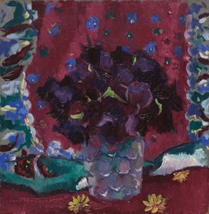 Blue pansies in a glass