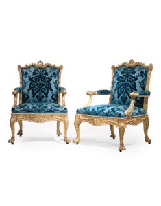A pair of George III giltwood armchairs by Robert Adam
