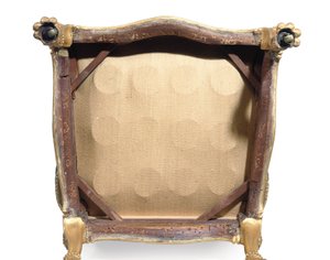 One of a pair of George III giltwood armchairs by Robert Adam