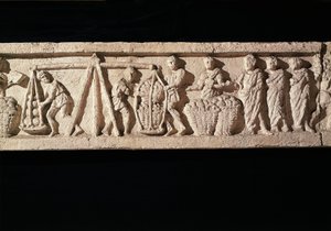 Relief portraying the stacking of loaves in baskets and taking them for weighing by Roman