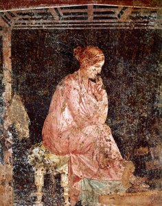 Young woman sitting by Roman