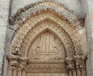 The crucifixion of St Peter, false portal of the church (sculpture) by Romanesque