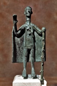 Nuragic culture: bronze statuette of traveller holding a stick and covered with a cape. Cagliari, Museo Nazionale Archeologico, Sardinia, Italy by Sardinia Nuragic Civilization