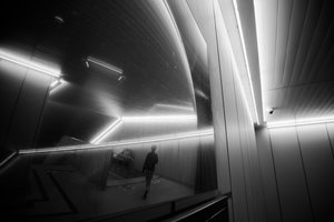 Solitary Figure Modern Hallway