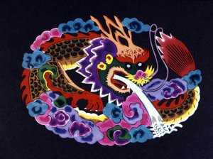Chinese paper cut and colored with a dragon by School Chinese