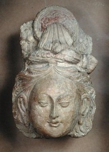 Head of a Bodhisattva with an elaborate hairstyle, from Tumshuq by School Chinese
