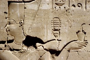 Wall painting/carving, The pharaoh Ptolemy shaking a systrum and offering incense, Temple of Horus, Edfu