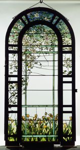 A leaded glass trellised window depicting clematis vines, early 20th century by Studios Tiffany