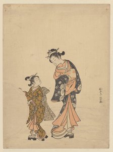 Young woman and girl with snowball
