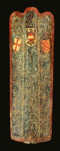 A rare Swiss pavise of wood covered with gesso painted canvas of green scrolling foliage design and the shields of arms of Habsburg, the League of St George, and the town of Winterthur by Swiss School