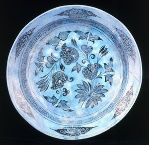 A turquoise glazed dish, with stylised floral spray, 15th century by Syrian School