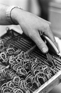 Computer operator Don Murray working with IBM early digital computer that uses punch cards by Ted Spiegel