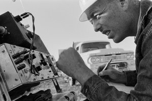 Mineralogist studies data at Morenci mine for Phelps Dodge Smelter Douglas Arizona by Ted Spiegel