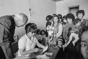 Young mothers with children and babies visiting a Santiago clinic to learn about birth control