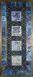 A Favrile glass tile panel, molded with flowers and geometric designs, 20th century by Tiffany Studios