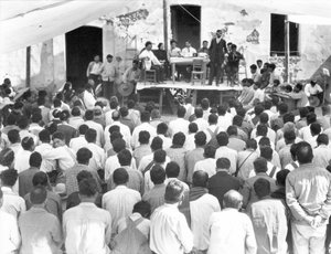 Meeting of the Campesinos: At the table Xavier Guerrero and Julio Antonio Mella, Jalapa, Mexico, 1927 by Tina Modotti