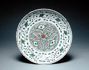 Dish decorated with stylised flowers, Isnik, late 16th century by Turkish School