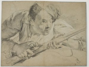 Hunter with a gun seen from the front