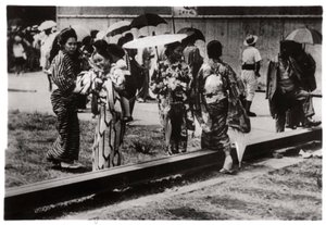 Japanese Women by the Zeppelin Hangar, Kasumigaura, Japan by Unbekannt