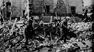 South Wales had its turn early in the New Year. A stretcher party carries a casualty to safety by Unbekannt