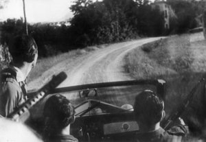 The Italian resistance movement: armed partisans on a jeep, Langhe, Piedmont, Italy