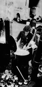The W.V.S. Did Many Jobs. Here is a W.V.S. Woman Managing a Field Kitchen by Unbekannt