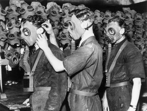 Three men wearing gas masks, c 1930s by Unbekannt