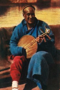 Travelling musician, China, c1928 by Unbekannt