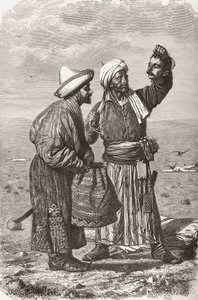 An Afghan soldier holding the severed head of his enemy