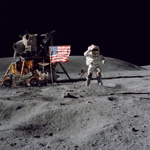 Astronaut John W. Young salutes the United States flag during Apollo 16 mission by Unbekannt