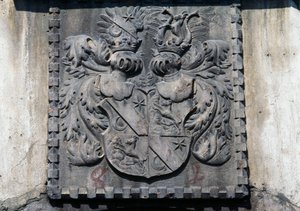 Coat of arms on wooden door of home in Lavis, Trento, Trentino-Alto Adige, Italy
