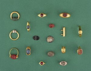 Collection of Roman, Etruscan and Hellenistic Jewellery including a Phoenician scarab ring, a cameo, amulet holders and an agate intaglio