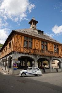 France, Arreau, Citroen 2CV on road next to medieval covered market
