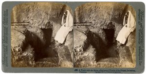 A tomb with the entrance stone rolled away, Jerusalem, 1901 by Underwood and Underwood