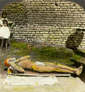Hindu devotee on a bed of nails near the shrine of Kali, Calcutta, India, early 20th century by Underwood and Underwood