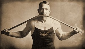 Californian Strongman Mr. P. A. Linebarger bends an iron bar with his teeth, San Francisco c.1922 by Unknown