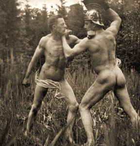 Fighting battle pose with a Roman Helmet, c.1910